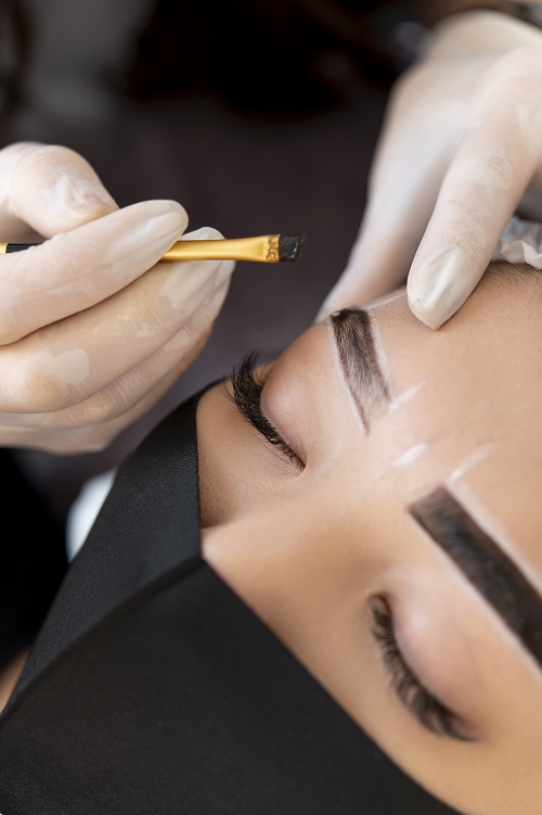 beautician-doing-microblading-treatment-client-s-eyebrows.jpg